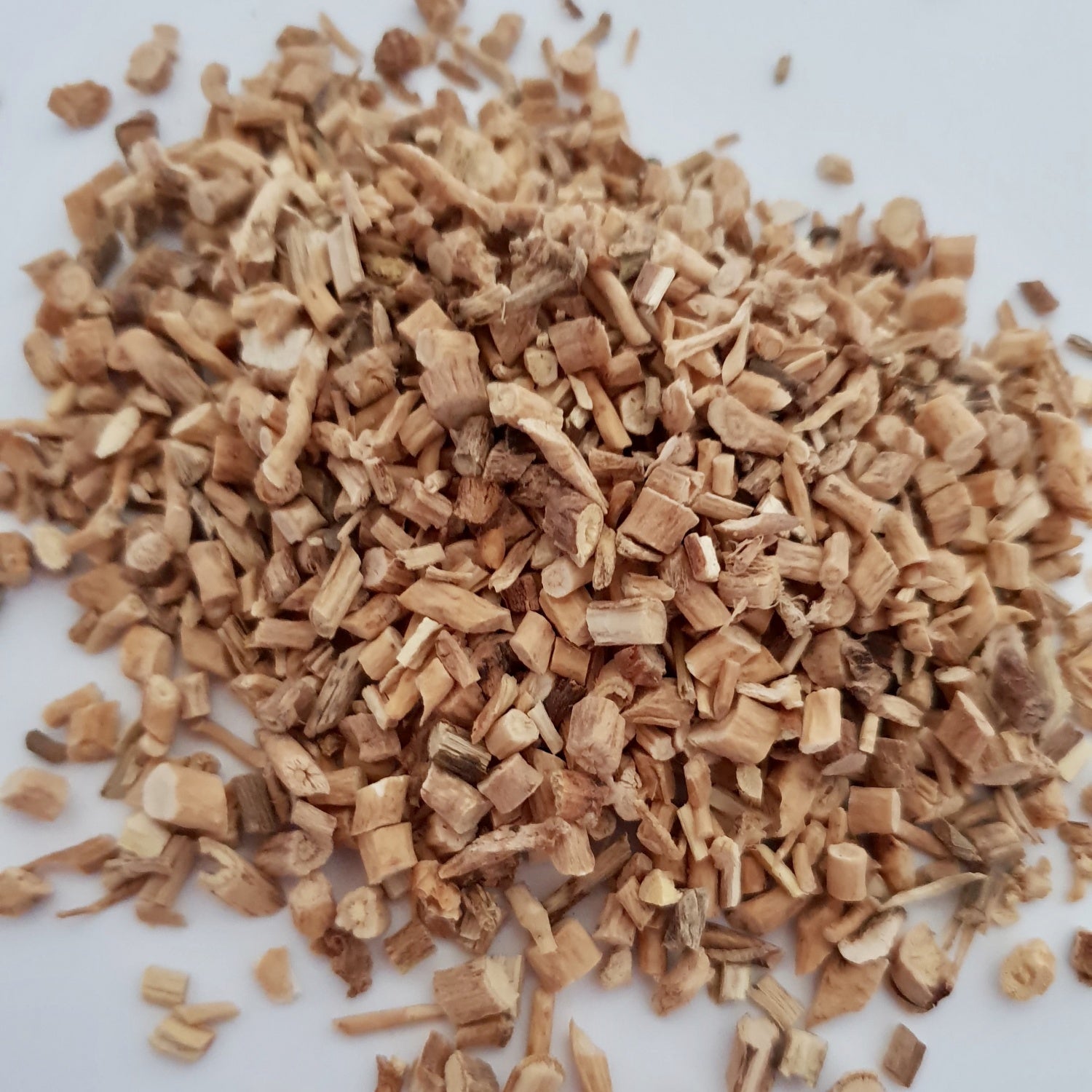 Astragalus Root herb on a white surface.