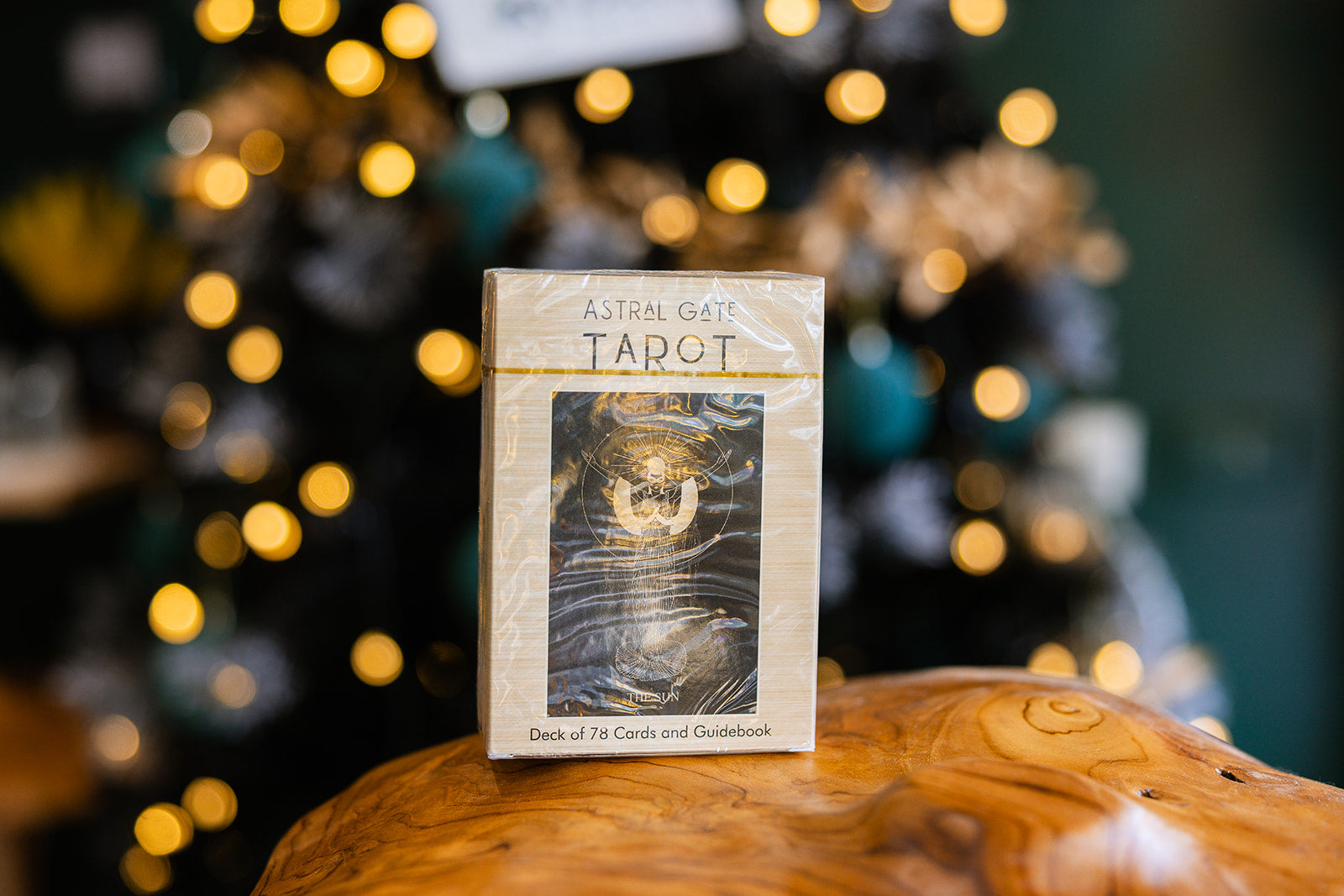 Tarot cards The Astral Gate Tarot Deck (Large)displayed on a wooden surface