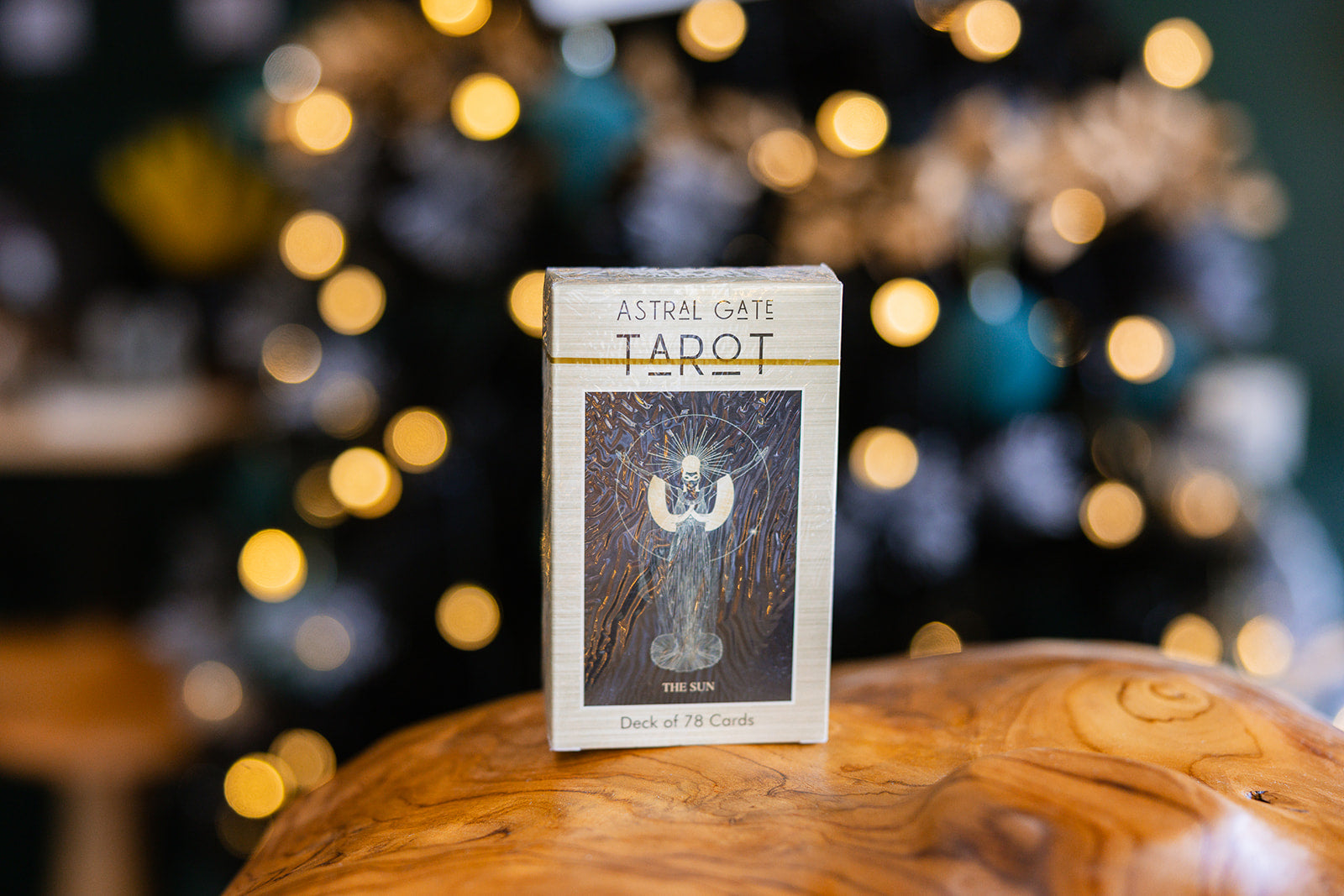 Tarot cards The Astral Gate Tarot Deck (small)displayed on a wooden surface