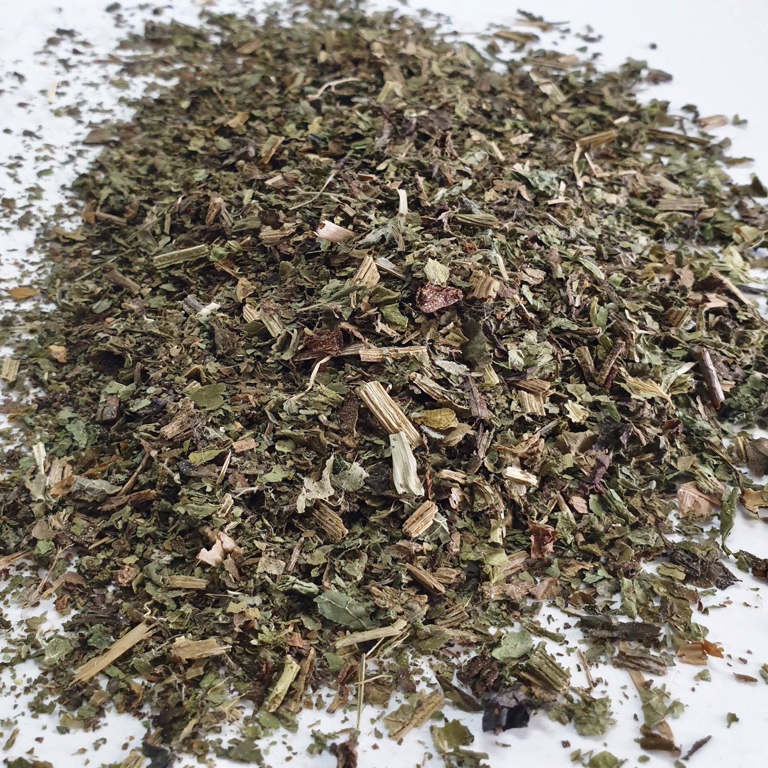 Comfrey Leaf herb on a white surface.