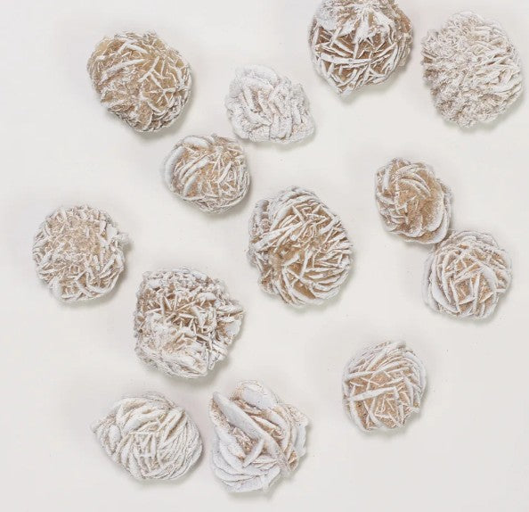 The image displays several Desert Rose Crystals These unique mineral specimens are also known by other names such as Selenite Rose, Sand Rose or Gypsum Rose