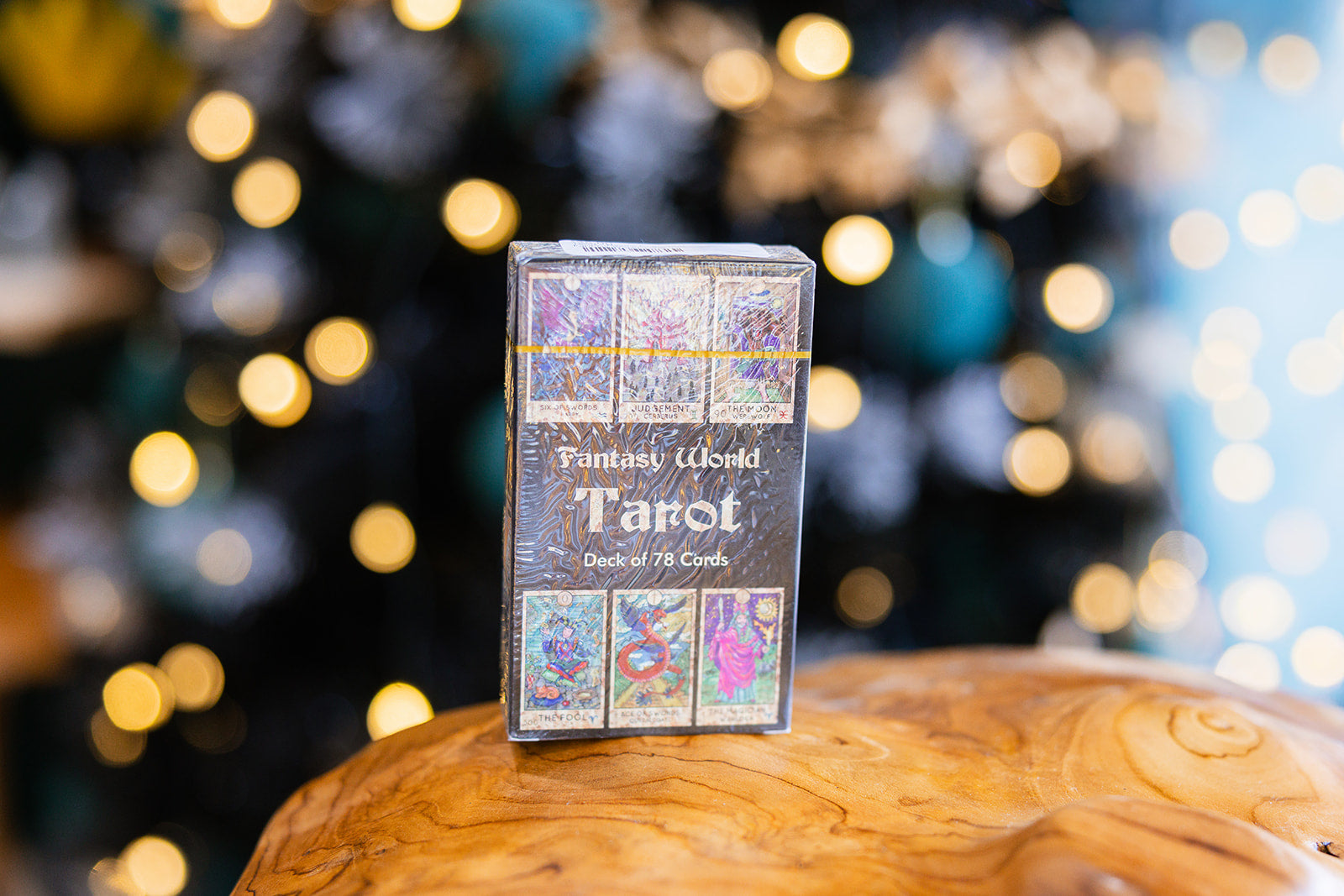 Tarot cards Fantasy World Tarot Deck displayed on a wooden surface