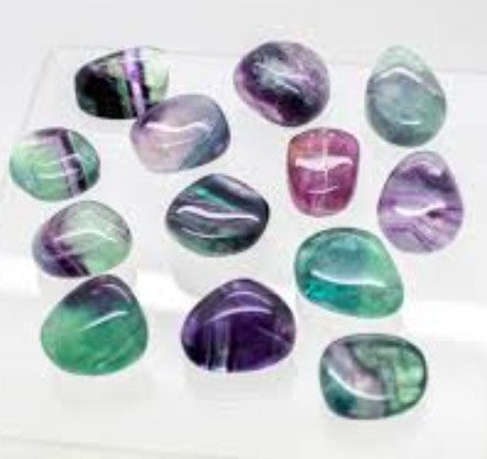 Crystals Fluorite Tumbles on a white background