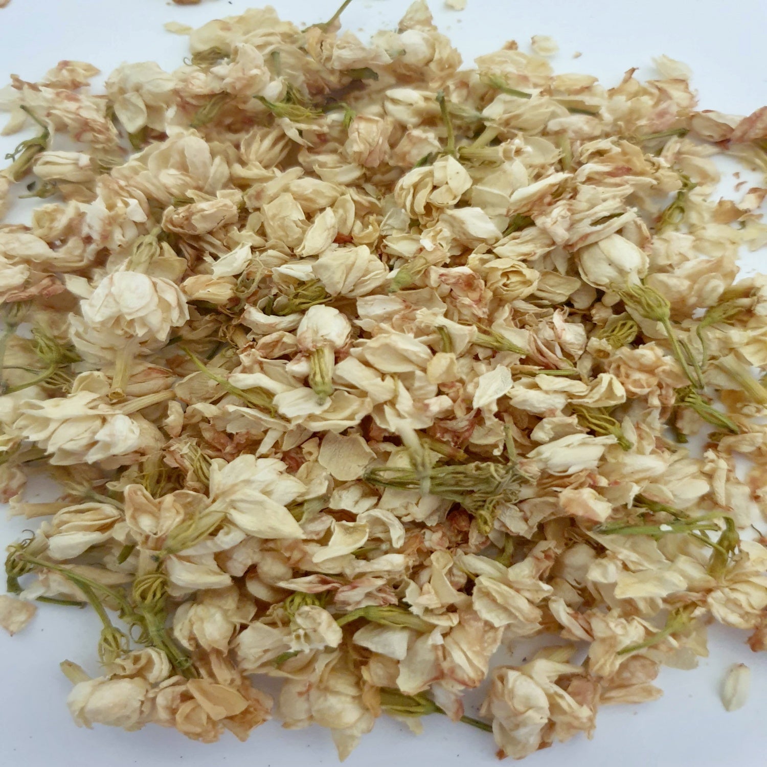 Jasmine herb on a white surface.