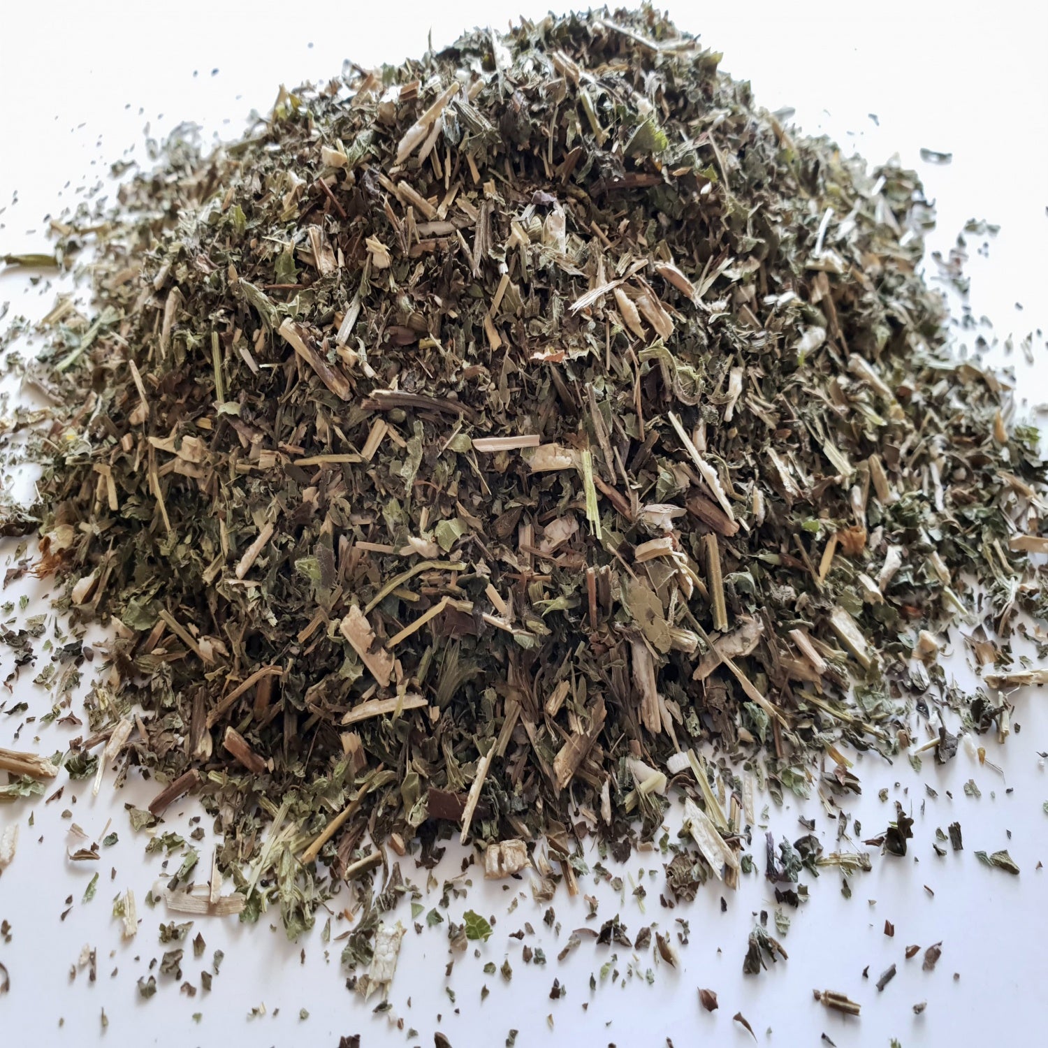 Lemon Balm herb n a white surface.