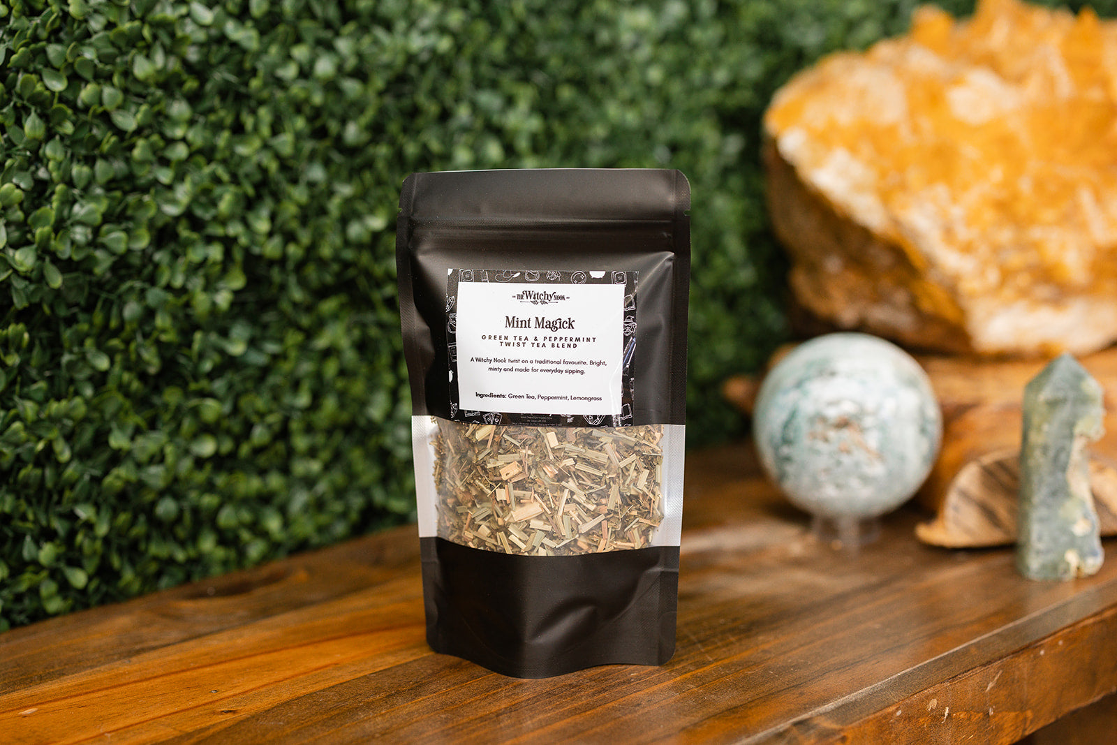 Mint Magick Tea Blend on timber benchtop with crystals in background