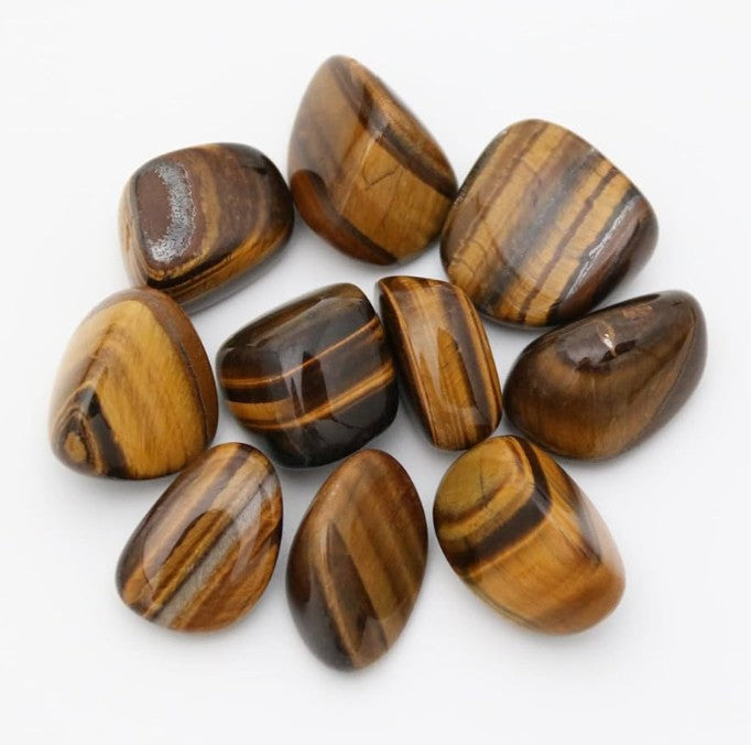 Crystals Tigers Eye Tumbles on white background