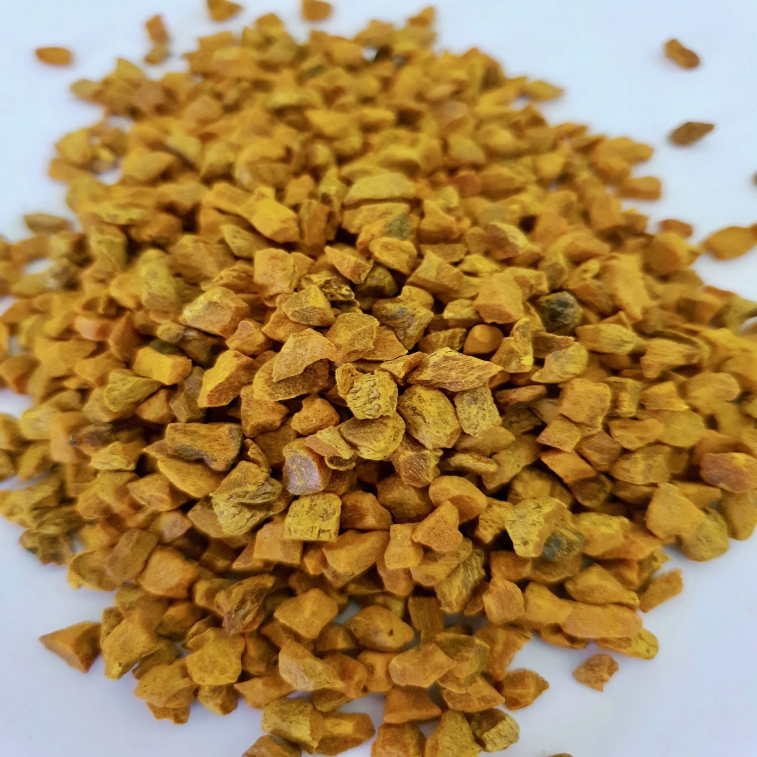 Turmeric herb on a white surface.