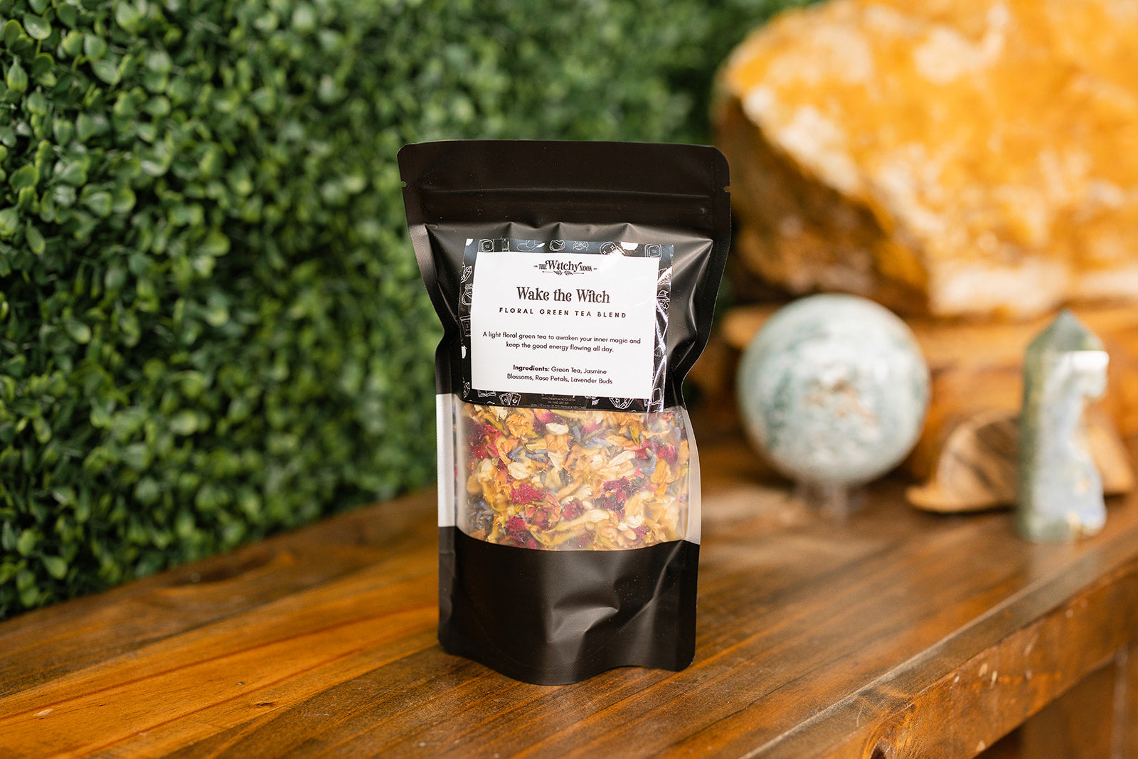 Wake the Witch Tea Blend on timber bench with crystals in background